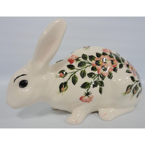 244 - Griselda Hill (Wemyss)Large figure of a rabbit decorated with underglazed wild roses, on green stalk... 