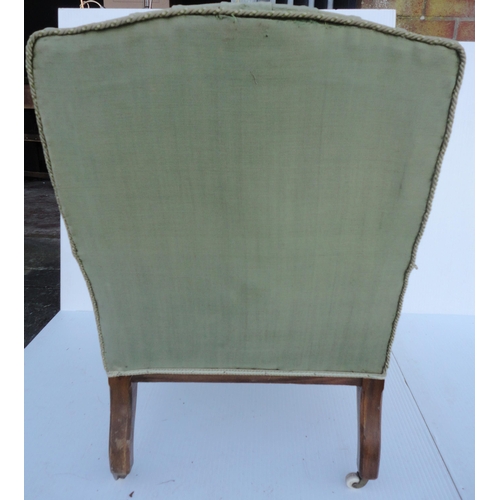 464 - Victorian walnut armchair upholstered in period green button-back moquette, on fluted squat feet, br... 