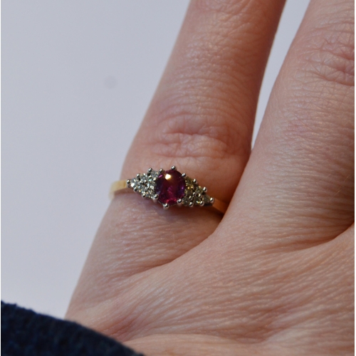 146 - Diamond and ruby ring, in 9ct gold, size L.