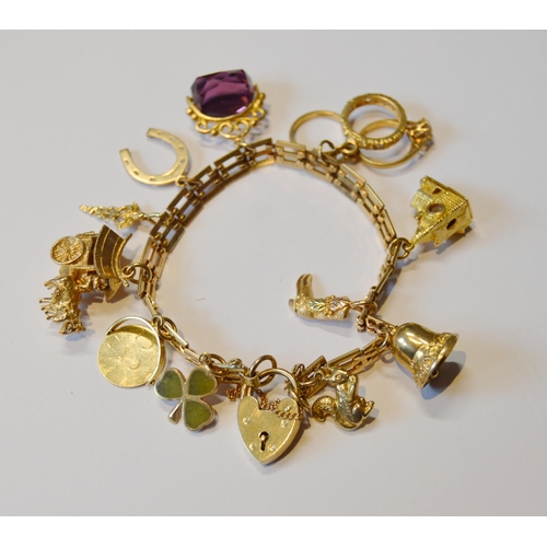 155 - 9ct gold charm bracelet with various gold and other charms dependant, 32.5g gross.