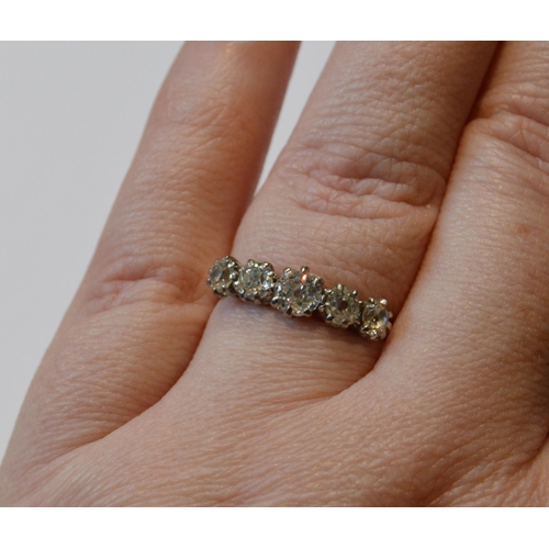 157 - Diamond five-stone ring with graduated brilliants, in gold, size P.