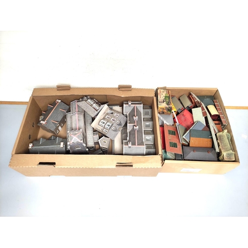 247 - Two boxes of model railway buildings and track components to include a church, station building, com... 