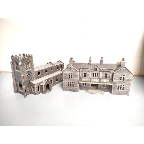 247 - Two boxes of model railway buildings and track components to include a church, station building, com... 