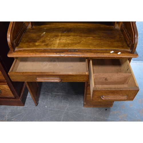 474 - Oak roll-top desk, c. 1930s, with tambour roller shutter enclosing drawers and pigeonholes, above th... 