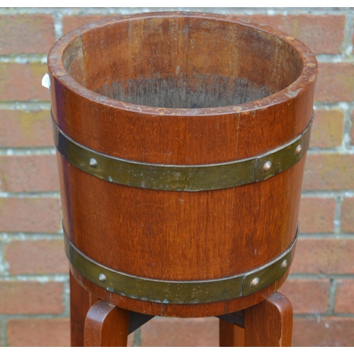 475 - Oak coopered barrel-top metal-bound jardinière stand by RA Lister & Co., Dursley, England... 