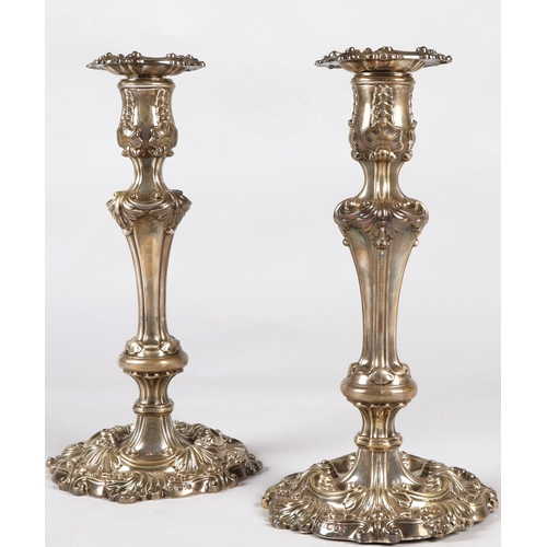 180 - Pair of ornate Georgian silver weighted candlesticks , assay marked Sheffield 1824, maker Waterhouse... 