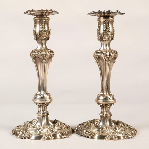 180 - Pair of ornate Georgian silver weighted candlesticks , assay marked Sheffield 1824, maker Waterhouse... 