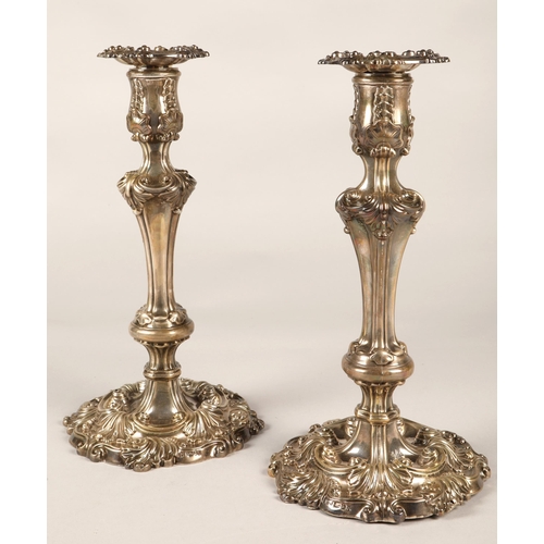 180 - Pair of ornate Georgian silver weighted candlesticks , assay marked Sheffield 1824, maker Waterhouse... 