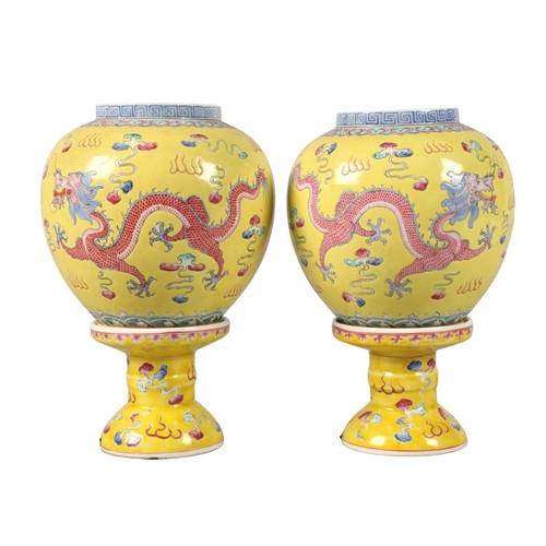 Pair of 20th century Chinese lanterns,on yellow ground with dragon decoration,21 cm high (2)