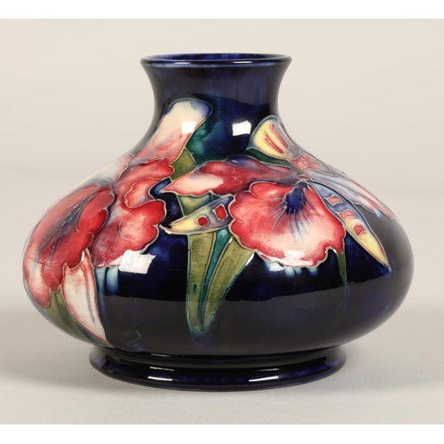 13 - Moorcroft pottery vase, of squat form, blue ground in the iris pattern, impressed mark with blue sig... 