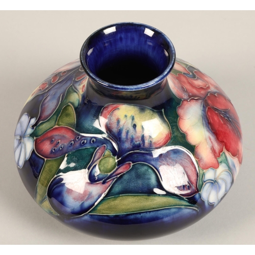 13 - Moorcroft pottery vase, of squat form, blue ground in the iris pattern, impressed mark with blue sig... 