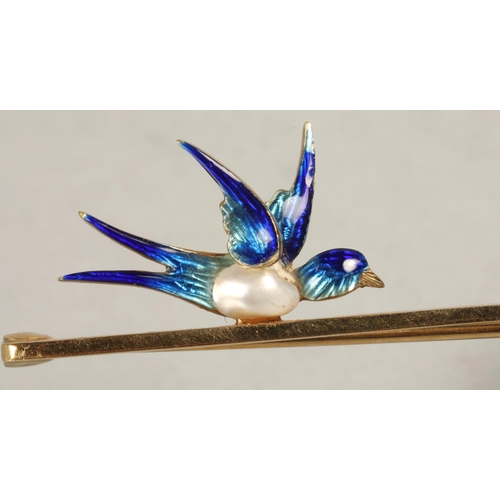 89 - Ladies 15ct gold bar brooch with mounted enameled swallow, 3.9 grams.