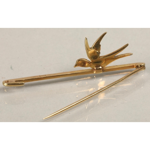 89 - Ladies 15ct gold bar brooch with mounted enameled swallow, 3.9 grams.