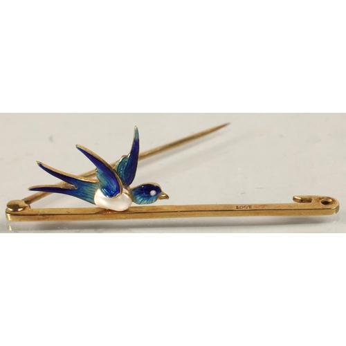 89 - Ladies 15ct gold bar brooch with mounted enameled swallow, 3.9 grams.