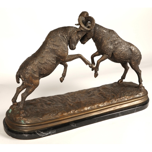 247 - Twentieth century figure of two rams fighting on marble base, signed T R, 75cm long, 47cm high