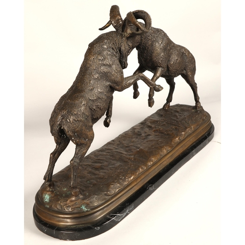 247 - Twentieth century figure of two rams fighting on marble base, signed T R, 75cm long, 47cm high