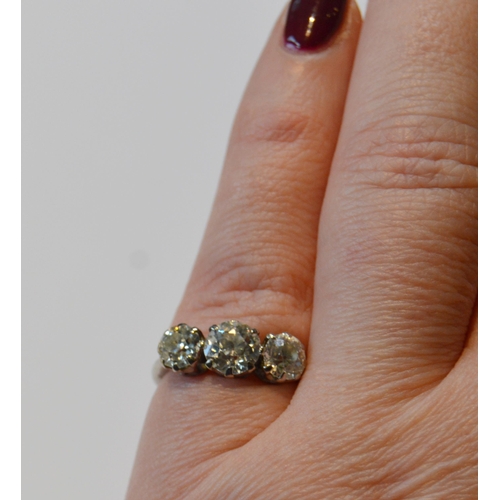 158 - Diamond three-stone ring set with three old brilliant-cut graduated stones in a claw setting, approx... 