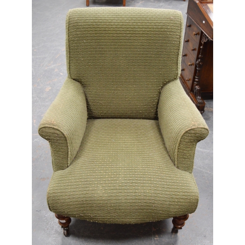 476 - Victorian walnut armchair upholstered in later green fabric, on turned supports and castors, maker's... 