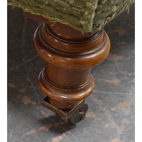 476 - Victorian walnut armchair upholstered in later green fabric, on turned supports and castors, maker's... 