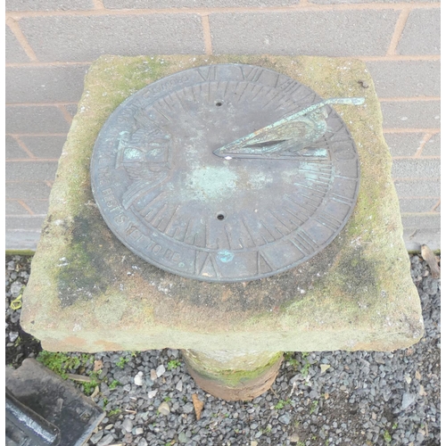 529 - Large sandstone sun dial on plain rounded column. 84cm high, x 35cms wide.