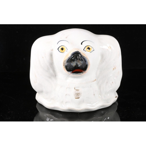 114 - Staffordshire pottery bank in the form of a spaniel, 10cm high.