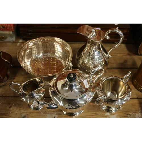 87 - Silver-plate to include a three piece teaset, a jug and a flower bowl.