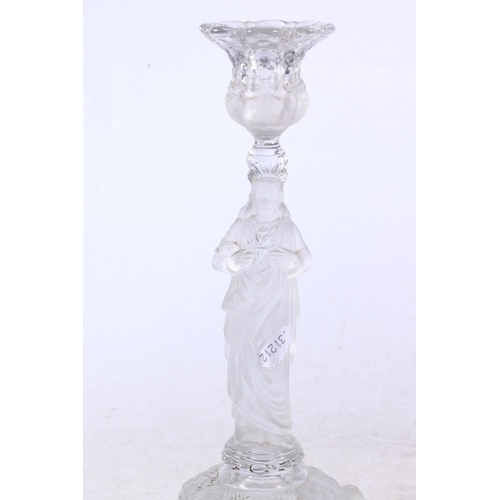 116 - French pressed glass candlestick in the form of Jesus, another pressed glass figure, and a small pre... 