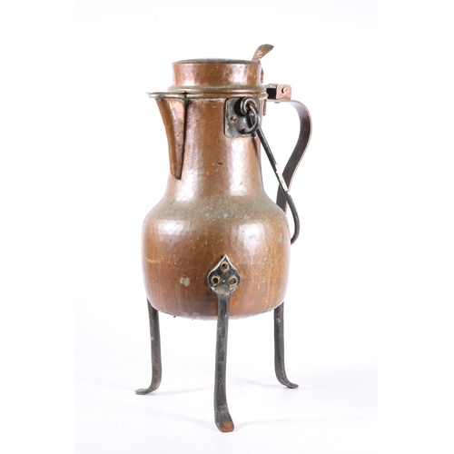 124 - Continental /Middle Eastern planished copper tea kettle on shaped iron feet.