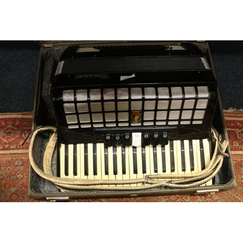 384 - Parrot black and white cased accordion.