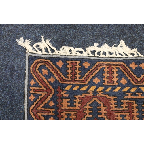 390 - Caucasian rug with geometric designs, 116cm x 74cm.