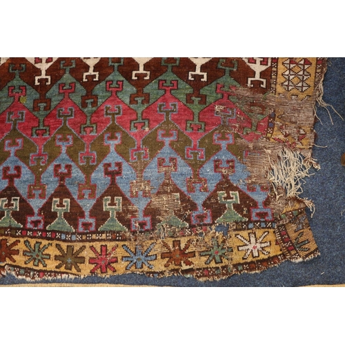 394 - Caucasian geometric design rug with polychrome colouring, 166cm x 141cm.