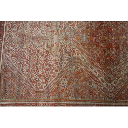 395 - Persian rust red rug, 10cm x 135cm.