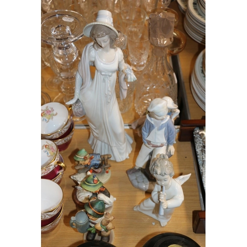 367 - Four Lladro figures and three Hummel figures.