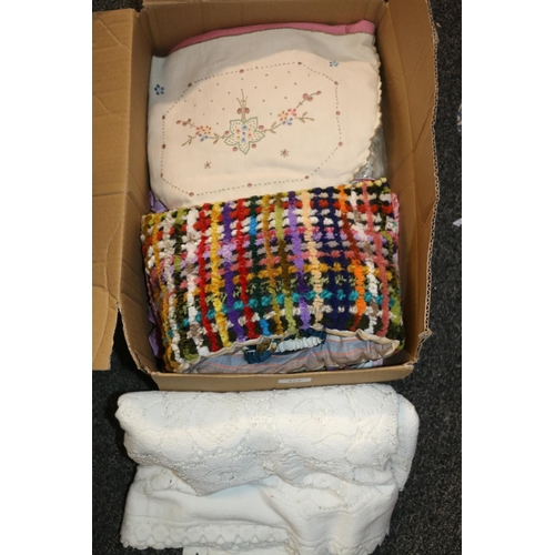 373 - Box containing embroidered tea cosies, etc.