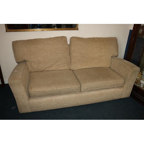 628 - Marks & Spencer two seater sofa in cream fabric upholstery, 195cm wide.