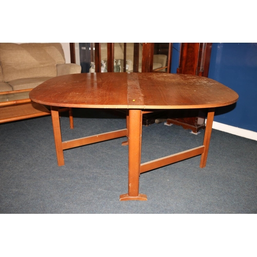 630 - Stained pine drop-leaf table, 73cm high.