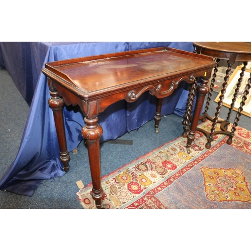 651 - Victorian mahogany side table raised on castors, 70cm.