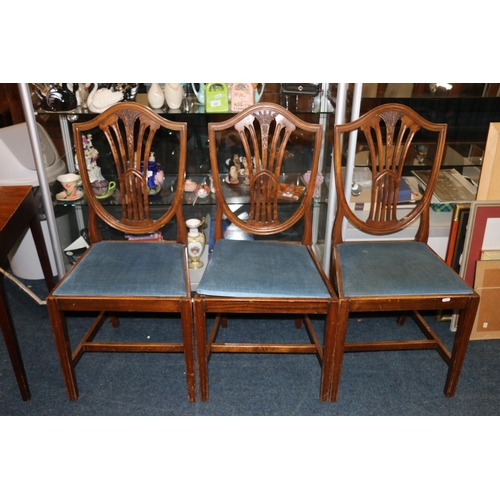 661 - Four Hepplewhite style shield back dining chairs with carved wheatsheaf splat.