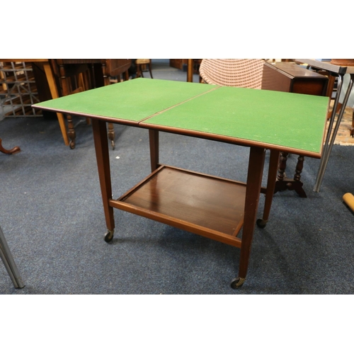 662 - Games table on castors with green baize top.