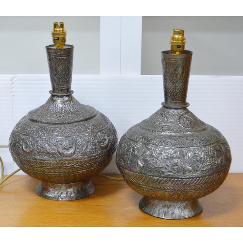 312 - Pair of Persian white metal baluster vase lamps, c. late 19th/early 20th century, embossed... 