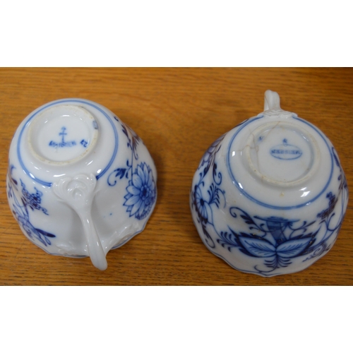 247 - Two Meissen blue and white 'Blue Onion' pattern porcelain trios, comprising a cup, saucer and side p... 