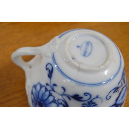 247 - Two Meissen blue and white 'Blue Onion' pattern porcelain trios, comprising a cup, saucer and side p... 