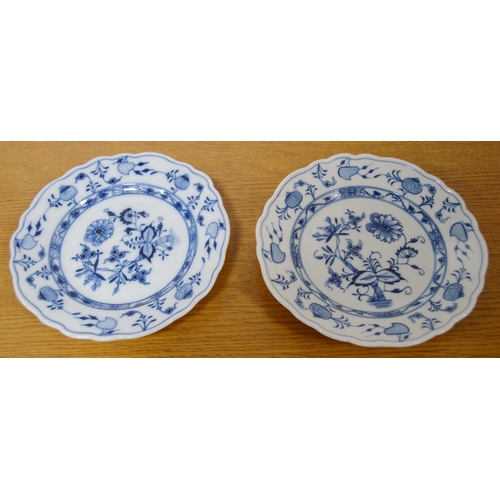 247 - Two Meissen blue and white 'Blue Onion' pattern porcelain trios, comprising a cup, saucer and side p... 