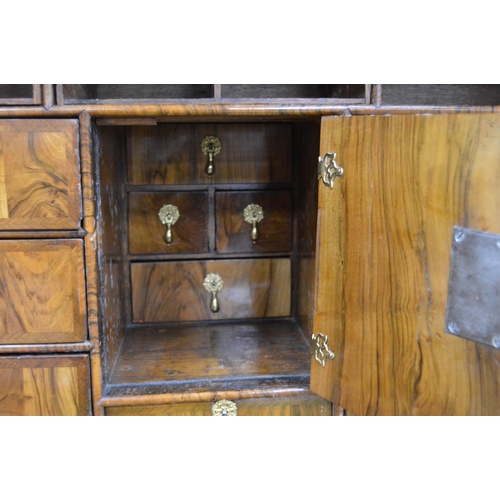 480 - Georgian burr walnut cupboard on chest, c. early 18th century, with long drawer above a fall front e... 