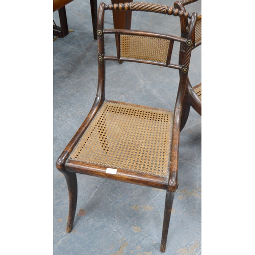 479 - Pair of Regency mahogany dining chairs, each with cane work to the back rest and seat, gilt metal ro... 