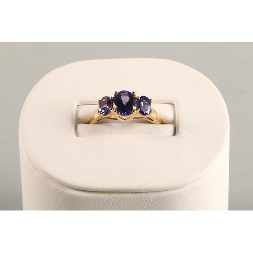 82 - Ladies 18ct yellow gold three stone tanzanite ring,ring size M.