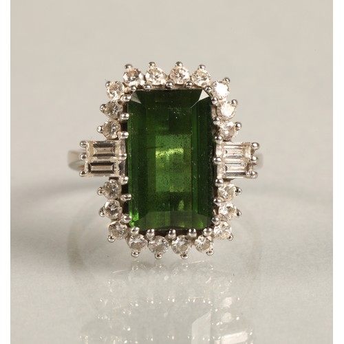 64 - Ladies 18ct white gold emerald and diamond ring, central emerald surrounded by twenty small brillian... 