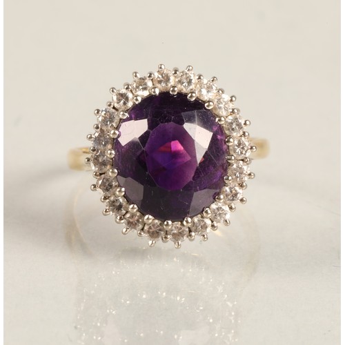 68 - Ladies 18ct yellow gold amethyst & diamond ring, central amethyst surrounded by twenty small dia... 