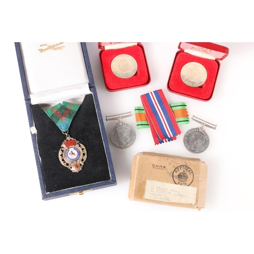 1451 - Medals of R Miller of Dalkeith comprising WWII war medal and Defence medal in cardboard issue box [R... 