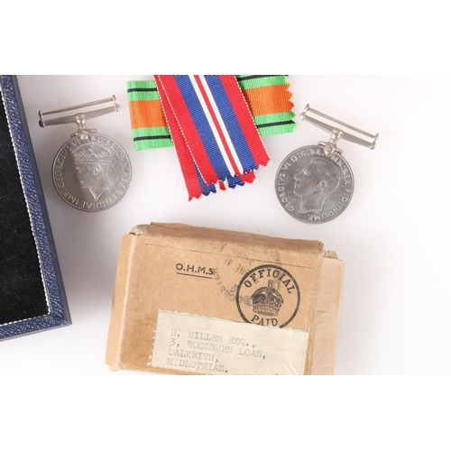 1451 - Medals of R Miller of Dalkeith comprising WWII war medal and Defence medal in cardboard issue box [R... 